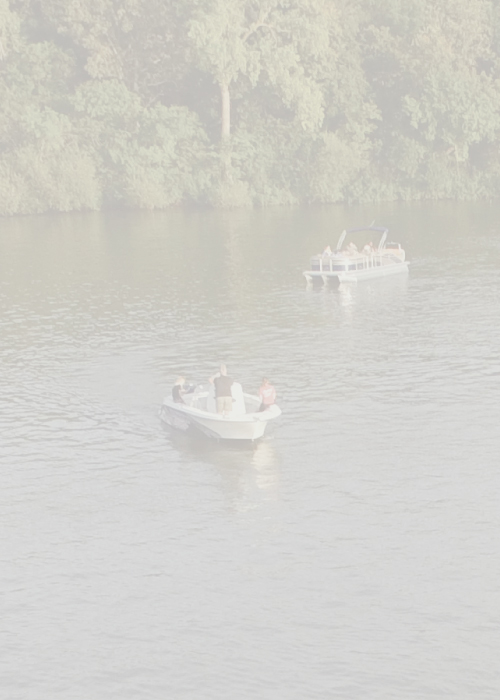 Boats on the water in the Iowa Great Lakes region